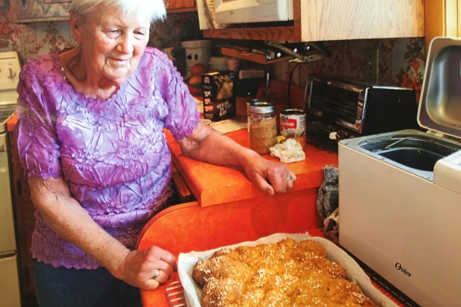 Gloria Johnson stands with a pan full of pulla